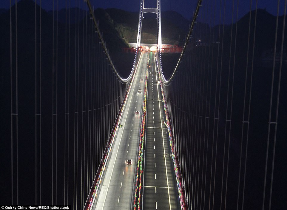  Bright shine: Aizhai is lit at night, thanks to its 1,888 lights and pedestrians are lucky to be able to use the panoramic walkway