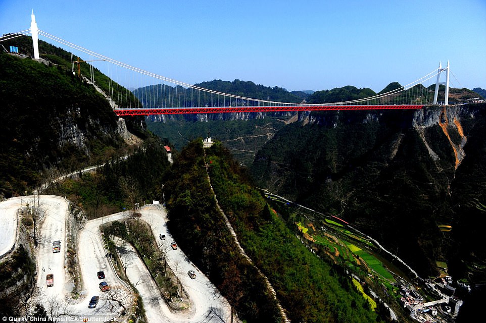 Spectacular views: Aizhai bridge lies beneath a mountainous  green valley known as Dehang canyon