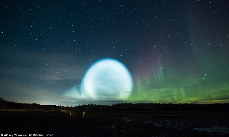 The first explanation for the sight was that a vivid display of the Northern Lights - or Aurora Borealis - was underway. This is why photographers were out watching the sky when the suspected UFO appeared