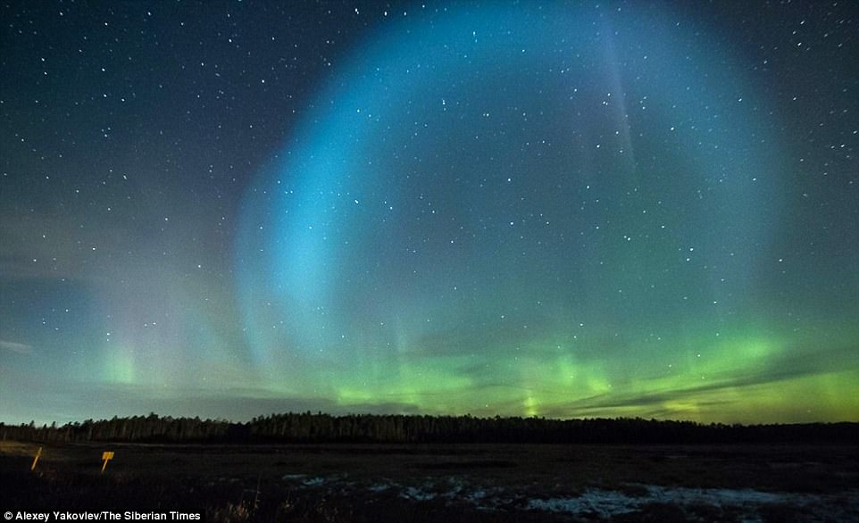 Photographer Alexey Yakovlev admitted to feeling scared as he witnessed the UFO spectacle at Strezhevoi, in the north of Tomsk region. He said: 'At first I thought - it is such a radiance of such an unusual form, round in shape. But gradually the ball began to expand, it became clear that this is not some radiance and it became scary'