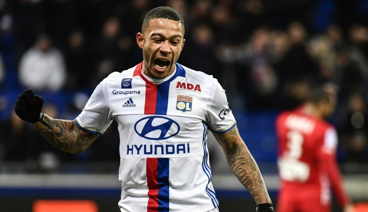 Lyon's Dutch forward Memphis Depay celebrates after scoring a goal during the French Ligue 1 football match between Olympique Lyonnais (OL) and Nancy (ASNL)  on February 8, 2017, at the Parc Olympique Lyonnais stadium in Decines-Charpieu, central-eastern France.  / AFP / JEFF PACHOUD        (Photo credit should read JEFF PACHOUD/AFP/Getty Images)