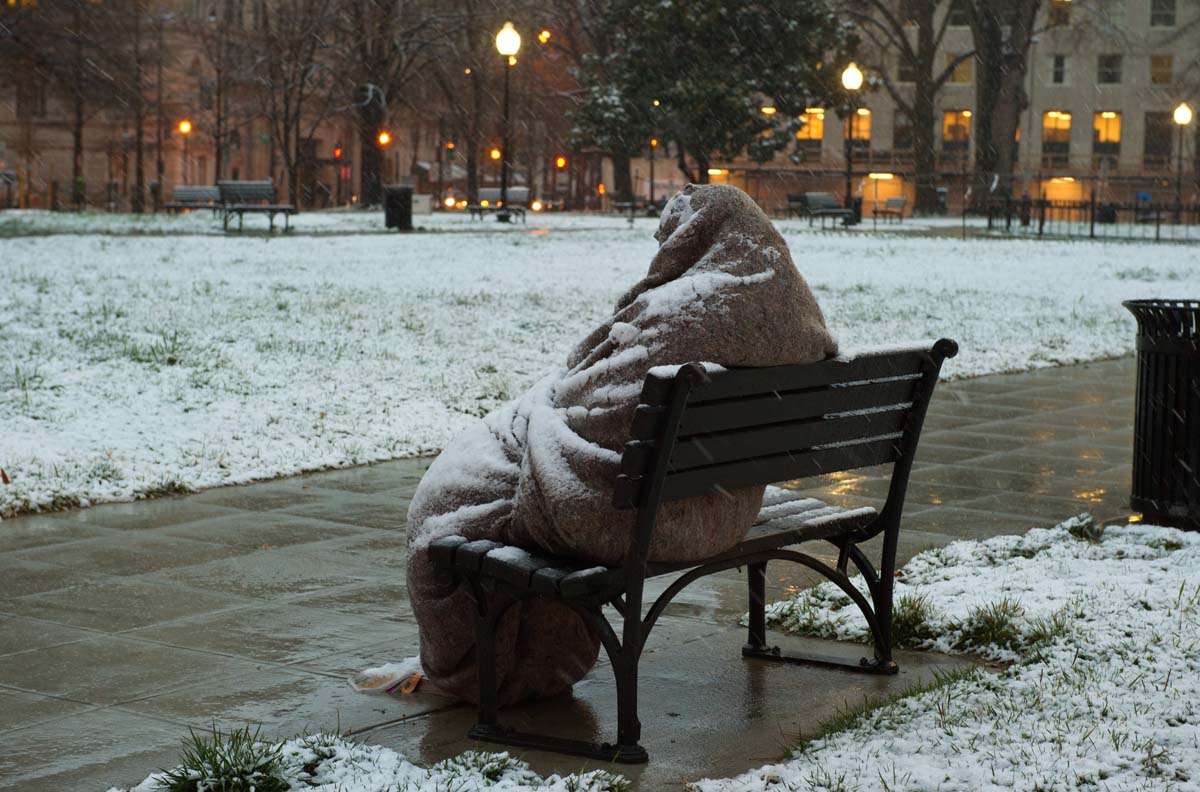 A homeless man sits covered in snow early on March 25, 2013 in Washington, DC. A messy Monday is in store for millions along the East Coast, with winter weather advisories warning of a mixture of snow and rain for Washington, DC, Philadelphia, metropolitan New York and parts of northeast New Jersey. AFP PHOTO / Karen BLEIERKAREN BLEIER/AFP/Getty Images ORG XMIT: