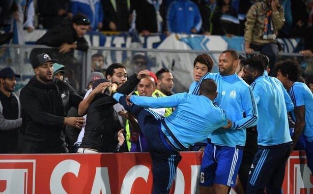 Patrice-Evra-was-sent-off-after-appearing-to-kick-a-fan-before-his-Marseille-sides-Europa-League-ti